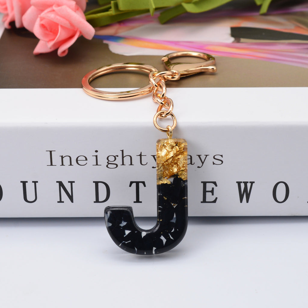 Carsine Black Pompom 26 Alphabets Keychain gold / J