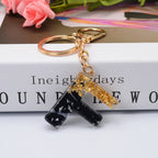 Carsine Black Pompom 26 Alphabets Keychain gold / F